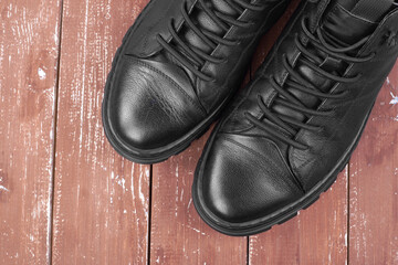 Clothes shoes and accessories - Closeup fragment Winter fur boots top view