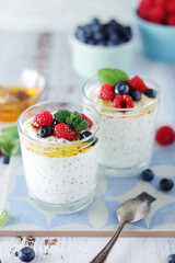 Greek yogurt in glasses with berries and quinoa	