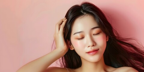 Fototapeta premium Beautiful Asian Woman With Long Black Hair Posing in Pink