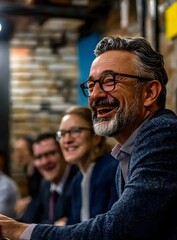 Fototapeta premium Smiling Senior Man in Blue Jacket During Business Meeting