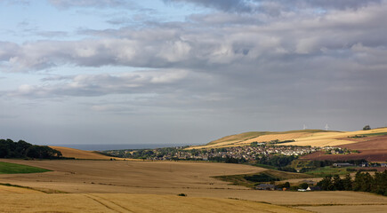 Fototapeta premium The small Scottish town of Inverbervie sheltered within the Valley on the North East Coast of Scotland on a Summers morning in August.
