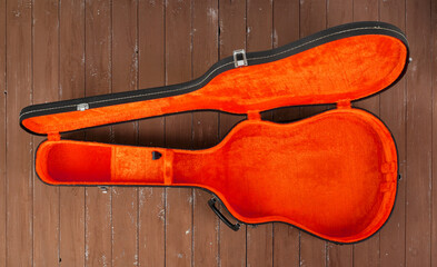 Musical instrument - Open black and red acoustic guitar hard case