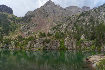 Beautiful lake in the forest at autumn day, Pirineos,  Huesca (Spain)