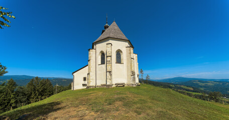 Fototapeta premium church in the mountains, Wolfgangikirche, Styria, Austria, Europe, July 2024
