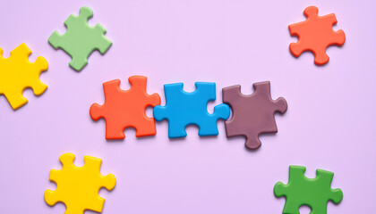 Colorful puzzle pieces on lilac background. Concept of autistic disorder isolated with white highlights, png