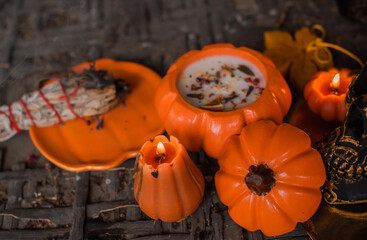 Candles scene with another design for Halloween party on a table, stuff for autumn Holidays