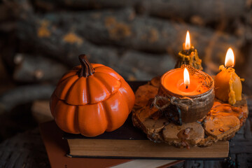 Candles scene with another design for Halloween party on a table, stuff for autumn Holidays
