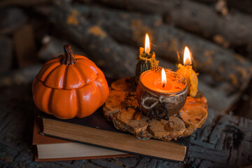 Candles scene with another design for Halloween party on a table, stuff for autumn Holidays