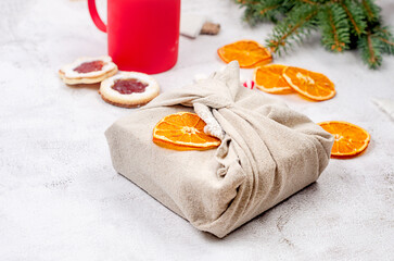 Eco-friendly and zero waste Xmas gift wrapping in traditional Furoshiki style . Zero waste,...