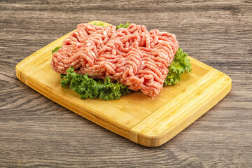 Raw pork minced meat over board