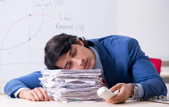 Busy businessman explaining business charts