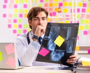 Male doctor with many conflicting prioritites