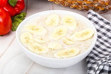 Sweet porridge with banana breakfast