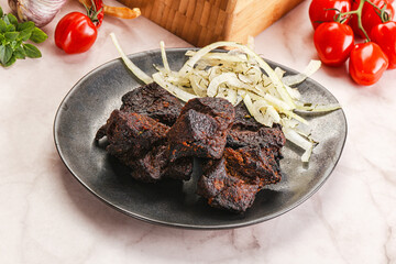 Grilled beef barbecue served onion