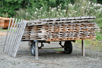 Stacked wooden slats parked on a trailer
