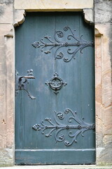 Old door, with decorated elements, in a church / monastery