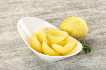 Canned yellow pear with syrup