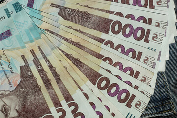 Banknote of 1000 Ukrainian hryvnias on a denim background in a pocket
