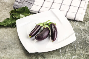 Small few baby eggplant over board