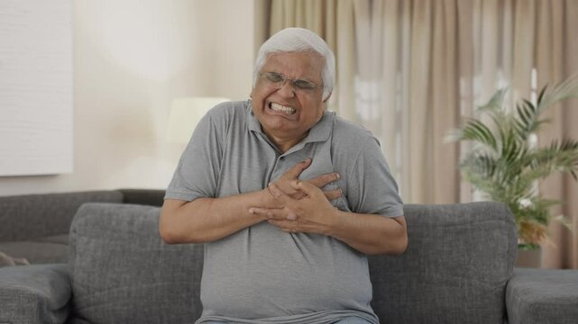 Sick Indian old man having a heart attack