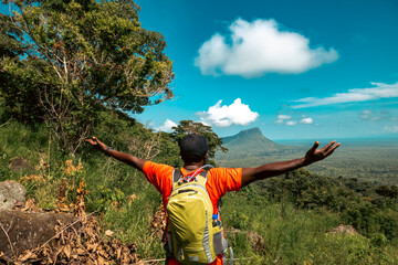 Scenic view of a hiker against a Mountain background at Mount Napak in Karamoja, Uganda
