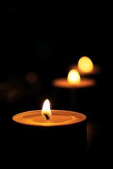 Minimalist view of candle flames flickering in a dark room AI generated illustration