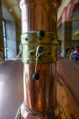 Manual damper on the chimney at the brass tank.