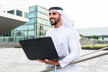 Arab middle-eastern man wearing emirati kandora traditional clothing in the city