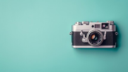 Fototapeta premium Vintage Camera on Turquoise Background.