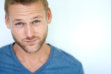 Confidence, portrait and man in studio with pride, casual fashion and creative career on mockup. Space, face and young professional with gen z style, relax and cool opportunity on white background