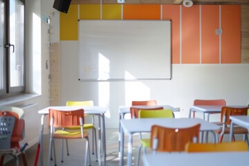 Brightly lit classroom with colorful chairs and empty desks facing a whiteboard, signaling a space ready for learning and education.