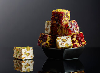 Traditional Turkish delight in a small black dish.
