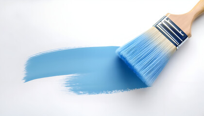 A person painting a smooth blue stripe on a clean white surface with a wide brush in natural light