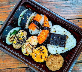 sushi on a plate with chopsticks