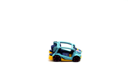 Fototapeta premium A Small Toy Car For Children, Made Of Iron With Isolated White Background, Rule Of Thirds Photo Composition