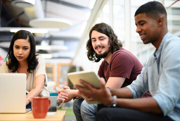 Business, team and communication with tablet in office for conversation, brainstorming and digital collaboration. Creative people, graphic designers and online with technology for visual project.