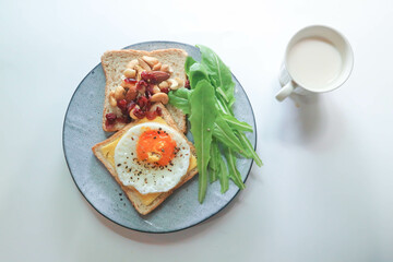 bread with egg and cheese topping or  sunny side up egg , lettuce and almond with dried cranberry and milk