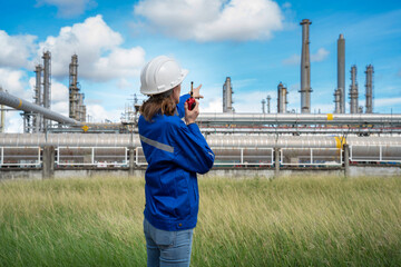 Senior Engineer wearing safety jacket and PPE working about Petrochemica Chemical Prodiction import...