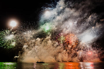 night fireworks over water