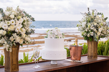 bouquet of white flowers and a wedding cake