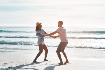 Happy, couple and dance with love at beach for outdoor adventure, marriage and honeymoon vacation. Man, woman and celebration with waves by ocean for commitment, connection and holiday in Cancun