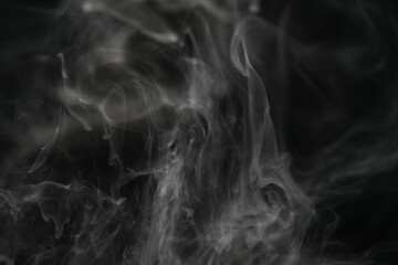 closeup abstract vapor over black background for backdrop or overlay
