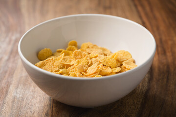 corn flakes in white bowl on table