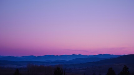 Dusk settles softly, blending hues of purple and indigo in the western sky.
