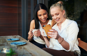 Reading, cellphone and friends in cafe, bonding and fun for women, gossip and happy to relax in...