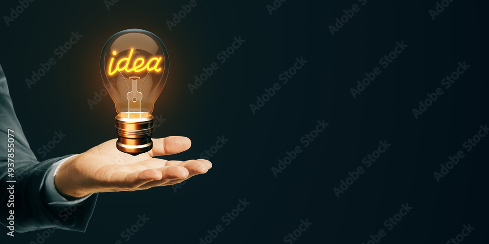 Aufkleber illuminated lightbulb with idea text in a man's hand on dark background. symbol of creativity and in