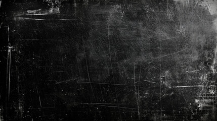 A high-resolution texture of an old, distressed blackboard background with visible scratches and dust creates a grunge or vintage effect. Ideal for enhancing design projects with a classic, aged appea