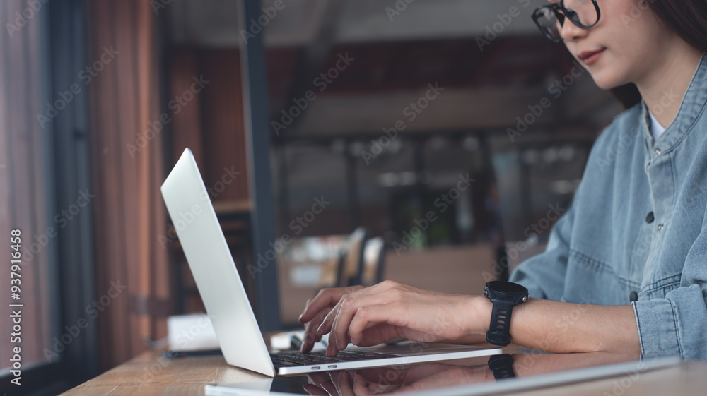 Canvas Prints asian woman working on laptop computer at coffee shop. female freelancer online working at cafe. stu