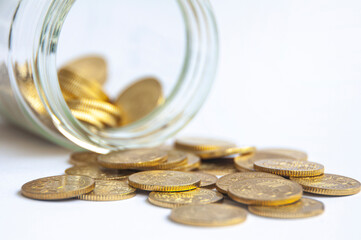Golden coins and jar background with customizable space for text or ideas. Wealth and copy space...