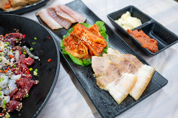 Fermented Skate and Steamed Pork Slices Served with Kimchi